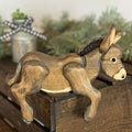 Handmade Wooden Donkey Shelf Sitter | Rustic Farmhouse Donkey Decor on a wooden crate with greenery in background.