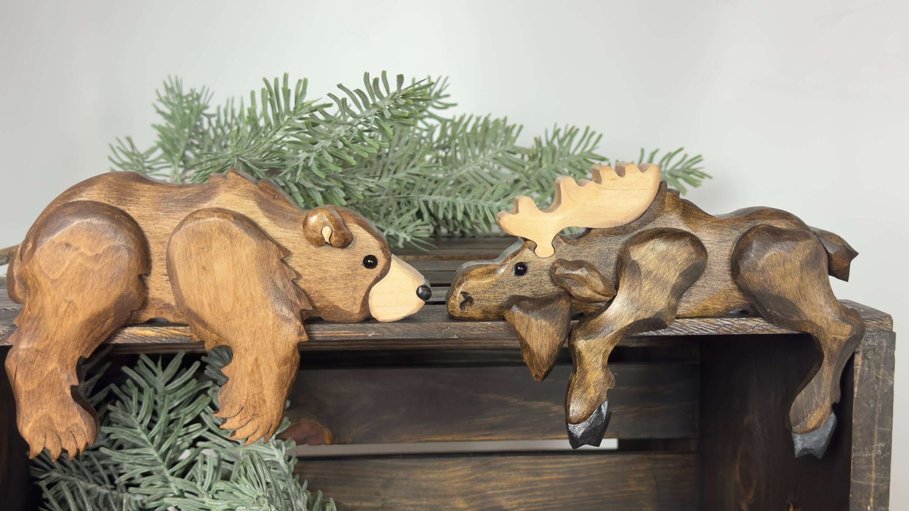 Montana wooden bear shelf decor featuring a carved bear and moose, perfect for rustic cabin decor.