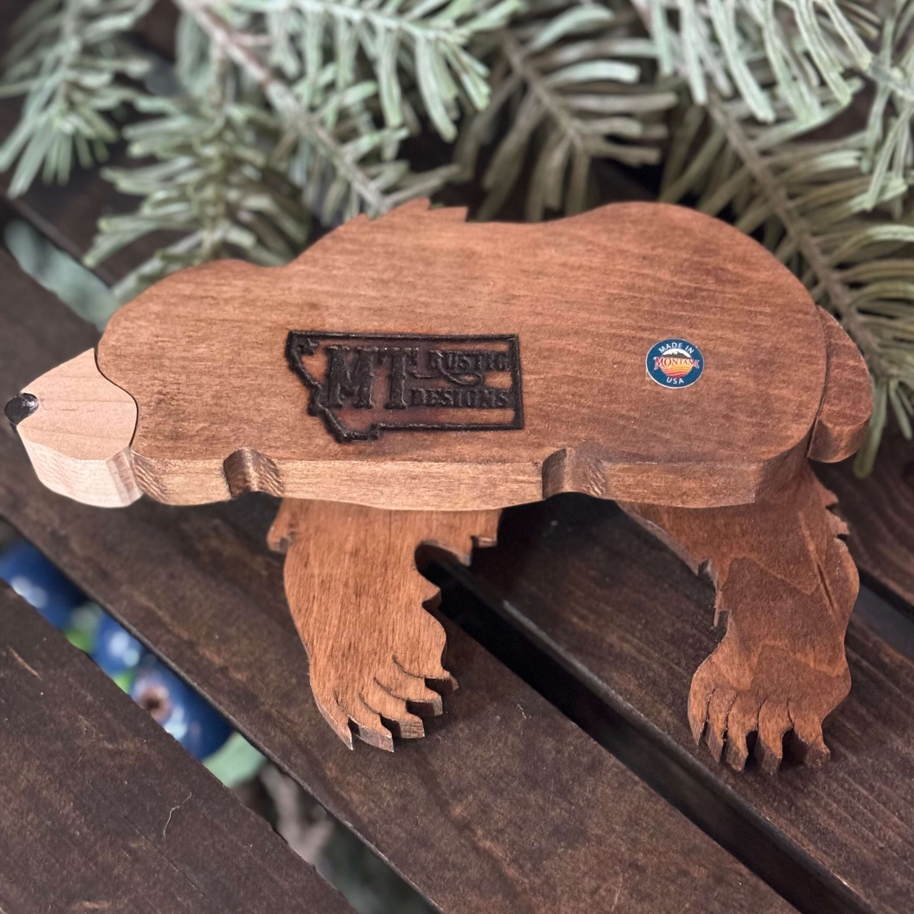 Montana wooden bear shelf decor shown in a detailed view, made from solid wood with a rustic finish.